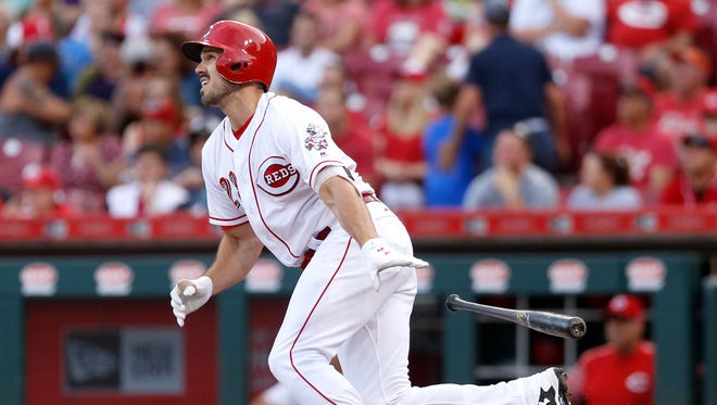 Cincinnati Reds left fielder Adam Duvall hits a solo home run against the Milwaukee Brewers during the second inning at Great American Ball Park.