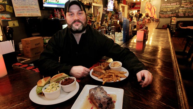 Chef John Skelton is pictured with some of his dishes at the Hilltop Tavern on Frankfort Avenue.