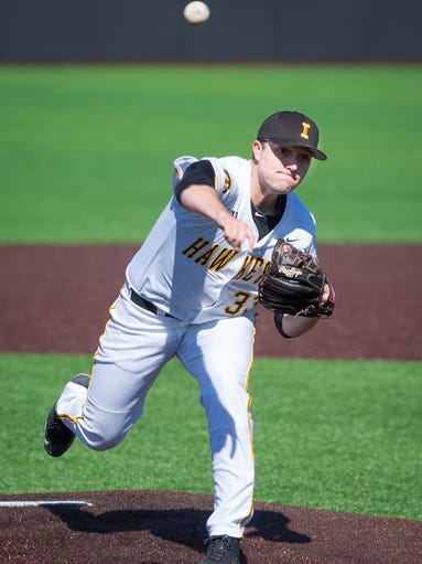 Iowa pitcher C.J. Eldred (33) throws in the top of