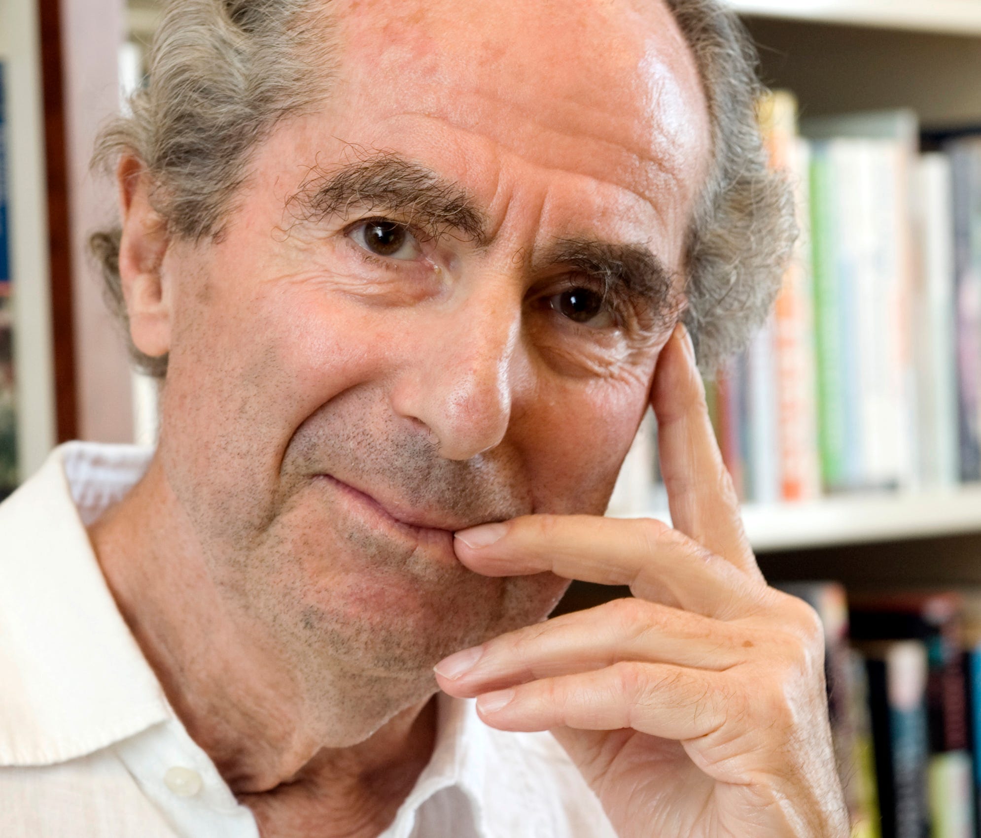 Philip Roth poses for a photo in the offices of his publisher Houghton Mifflin, in New York.