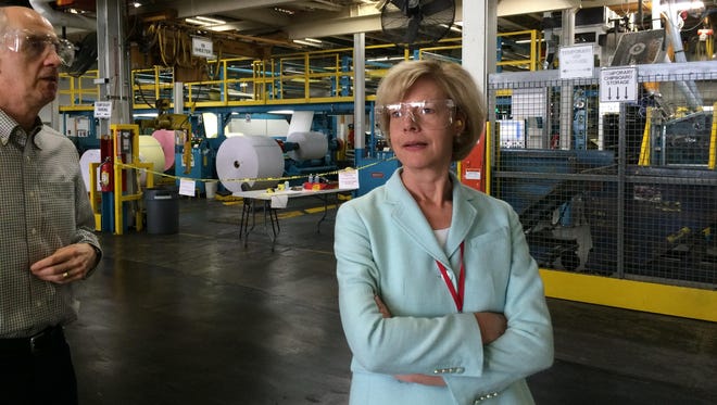U.S. Sen. Tammy Baldwin, D-Wis., takes a tour of Appvion’s plant Monday during her visit to support the Export-Import Bank. Companies like Appvion benefit from the exports the bank helps facilitate.