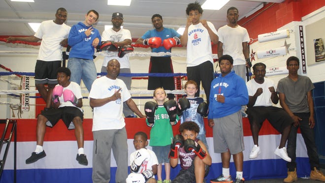 Several Norwayne boxers are pictured with club manager Erskine Wade (standing, second from left) during a break in training Thursday afternoon.