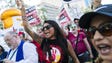Kristin Piestewa (center) chants with others protesting
