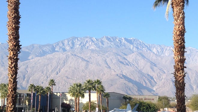 Snow is less visible on the San Jacinto Mountains that surround Palm Springs. Rising temperatures are causing the snow to melt.