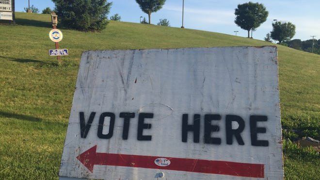 A sign on Fort Defiance Road points voters to the Fort Defiance precinct located at Clymore Elementary to nominate a state senate candidate on June 9, 2015.