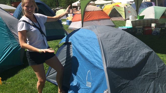 Erin Hull celebrates her first successful tent assembly at Telluride, CO.