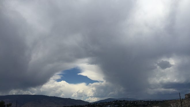 Storm clouds roll into Reno on Tuesday, July 21, 2015. Photo is taken at the intersection of Keystone Avenue and McCarran Boulevard.