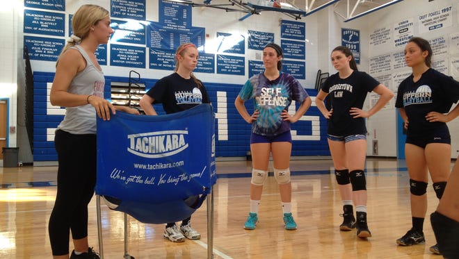 Suffern head coach Samantha Gutmann talks to her players during a team practice on Aug. 21, 2015.