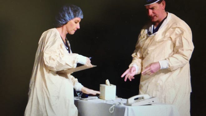 Dr. Joe Bujak and Kathleen Bartholomew, a nurse and author, on stage at an American College for Healthcare Executives conference, where they did a skit to illustrate issues between a nurse and surgeon who was exhibiting "disruptive behavior."