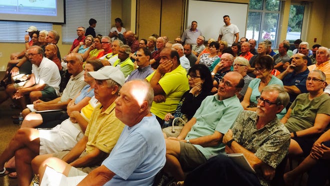 A crowd of more than 150 jammed the meeting room at Estero Fire Rescue administrative headquarters for a zoning board meeting on expanding the size of the Bella Terra community on Corkscrew Road.