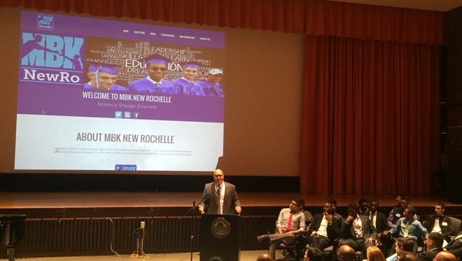New Rochelle High School Principal Reginald Richardson, co-chair of My Brother's Keeper New Rochelle, introduced the action plan to a crowded auditorium. Monday night.