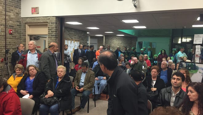 Residents packed the planning board meeting Tuesday to hear details of the affordable housing development.