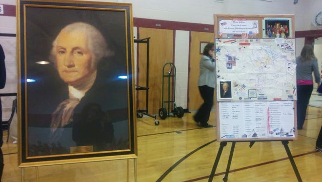 The Old Glory chapter of the Daughters of the American Revolution gave its 50th George Washington portrait to Oak View Elementary. On the right is a map of the 50 schools that now have George Washington portraits.