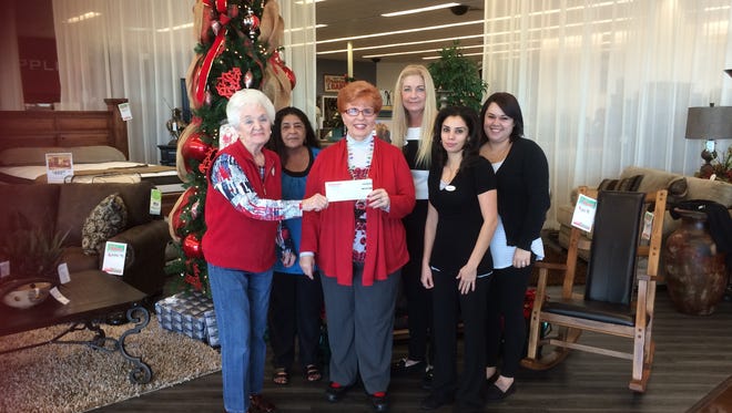 The Boulevard Home Furnishings store in Mesquite donated a $655 check to the Virgin Valley Food Bank.