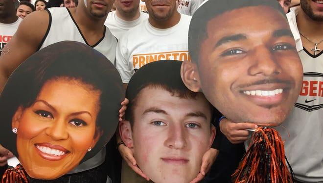 Michelle Obama, Spencer Weisz and Amir Bell were popular with Princeton fans Friday.