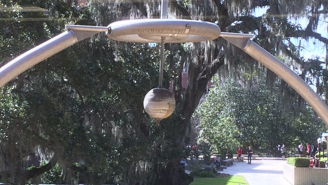 The sculpture, "Untitled Instrument," sits outside Dirac Library and acts as a pendulum with the wind.