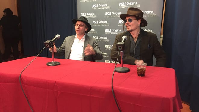 Lawrence Krauss, founder of Arizona State University's Origins Project, at a university discussion panel with actor Johnny Depp in 2016.