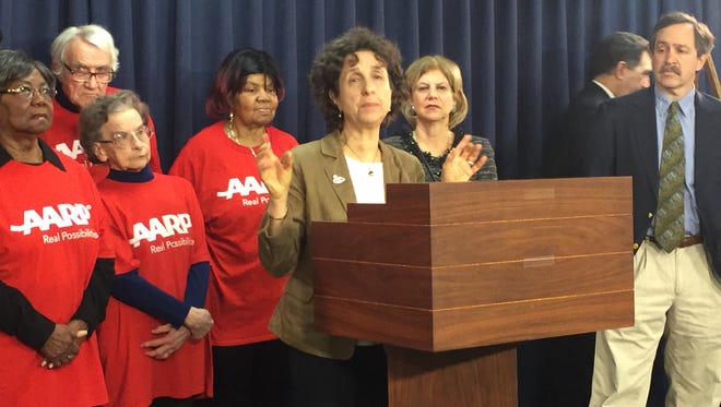 Parks and Trails New York executive director Robin Dropkin speaks out in favor of more transit funding as members of the AARP and Assemblywoman Shelley Mayer look on.