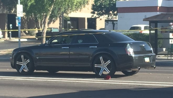 Phoenix police are looking for two vehicles in connection with a road-rage shooting that left the driver of this car injured near 48th Avenue and Baseline Road on March 18.