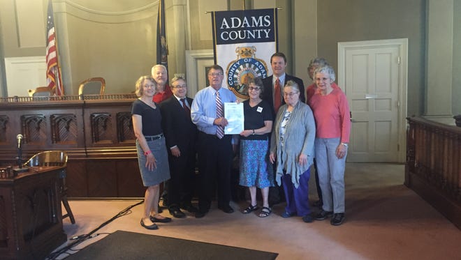 The Adams Count y Board of Commissioners pose with the Gettysburg Gun Safety Study Group on May 25, 2016 after proclaiming the upcoming Thursday as Gun Violence Awareness Day.