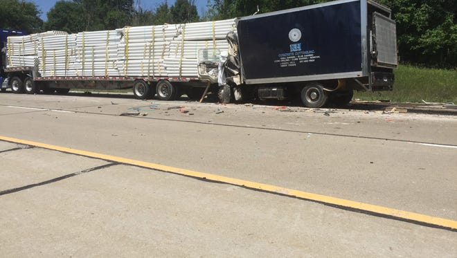 Michigan State Police said a 39-year-old Owosso man died Wednesday when his GMC box truck rear-ended the trailer of a Peterbilt semi trailer that had slowed for traffic on Interstate 96 in Howell Township.