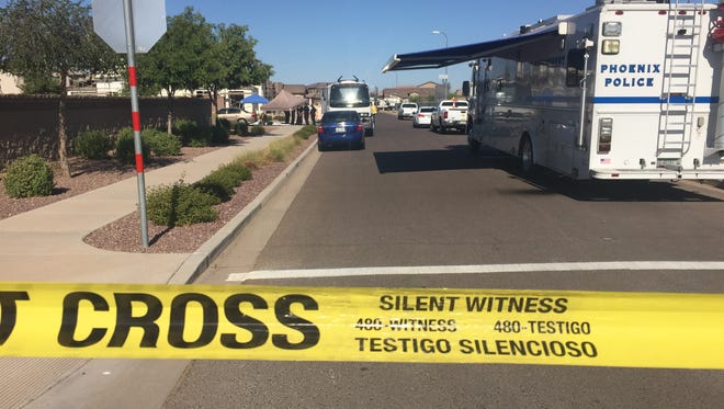 Phoenix police investigate a subdivision in Laveen, where human remains were found in a sewer line Thursday at 55th Avenue and Gwen Street.