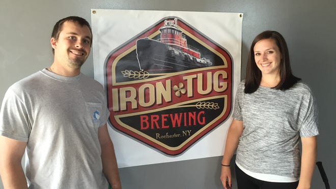 Keith Owens, owner and brewer, and his fiancée Allison Compton at the soon-to-open Iron Tug Brewing on West Ridge Road.