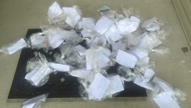Plastic bags with rocks and a letter urging people to join the KKK were found on some Fishers lawns.
