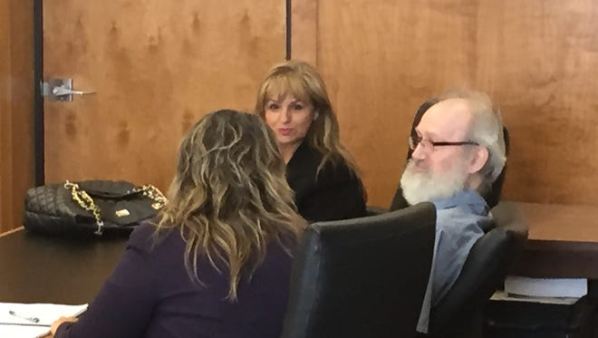 Michael Skidmore is flanked by defense attorneys Jaceda Blazef and Anica Blazef-Horner before a hearing Friday.