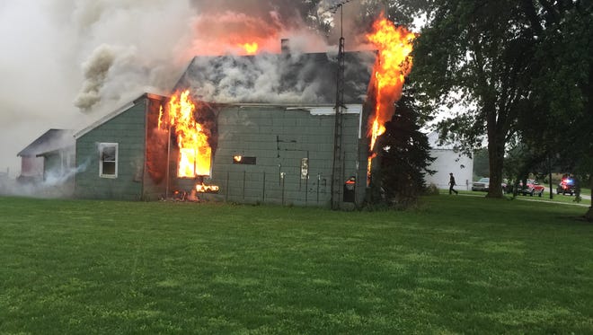 A vacant home in rural Clinton County burns during a fire Tuesday evening.