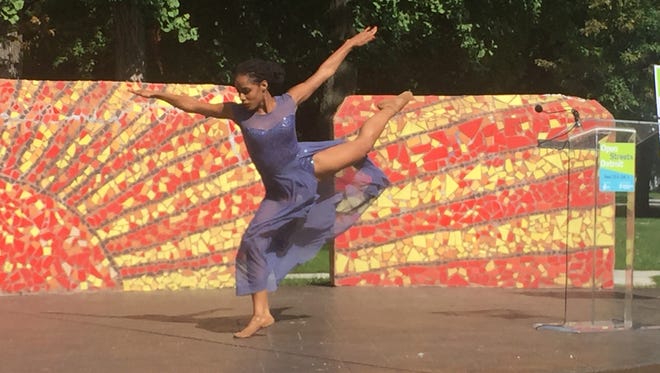 Detroiter Amber Moore, a dance instructor at the Detroit-Windsor Dance Academy, will participate in Open Streets Detroit Sept. 25 and Oct. 2. She demonstrates her dancing at Clark Park in southwest Detroit on Tuesday, Sept. 13, 2016.