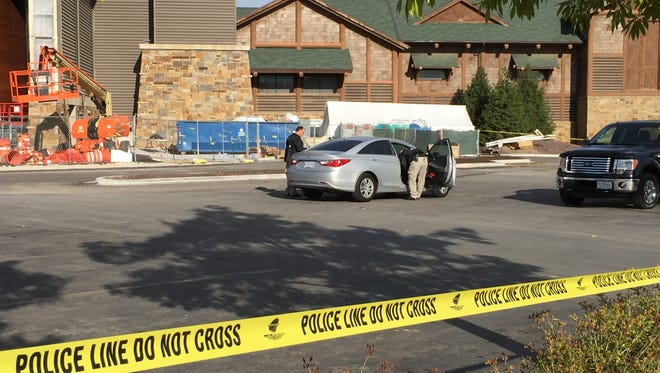 Police investigate a crime scene on the parking lot of Bass Pro Shops in Springfield.