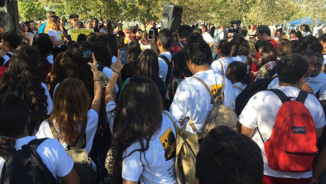 About 200 students walked out of Trevor G. Browne High School in Phoenix Friday afternoon, Nov. 4, 2016, to protest Republican presidential candidate Donald Trump and Maricopa County Sheriff Joe Arpaio.
