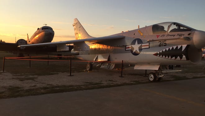 The Chennault Aviation and Military Museum unveiled a Navy A-7 Corsair II aircraft that was restored by volunteers on Friday.