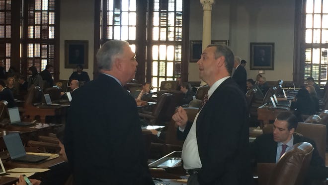 State Reps. Drew Darby and Rodney Anderson chat during the Texas House floor session on Wednesday..