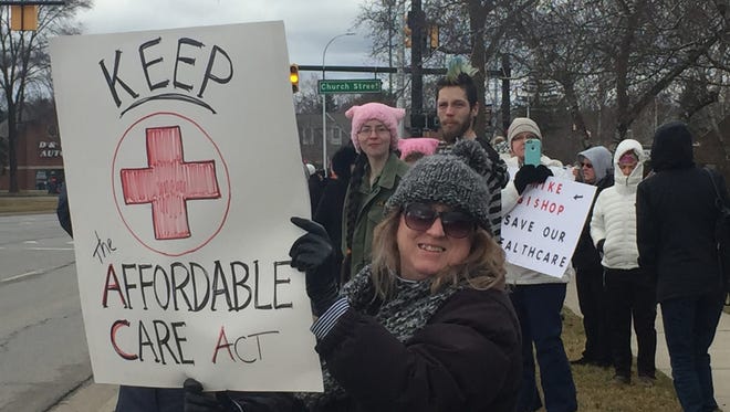 Submitted by E. Madigan
 Protesters gathered Saturday morning outside the Brighton office of U.S. Rep. Mike Bishop, R-Michigan, to oppose repealing and replacing the Affordable Care Act and speak out about other concerns.