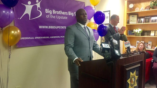 Lamont Sullivan, CEO of Big Brothers Big Sisters of the Upstate, and Greenville County Sheriff Will Lewis (right) announce the launch of the state's first Bigs in Blue mentoring program involving school kids and deputies