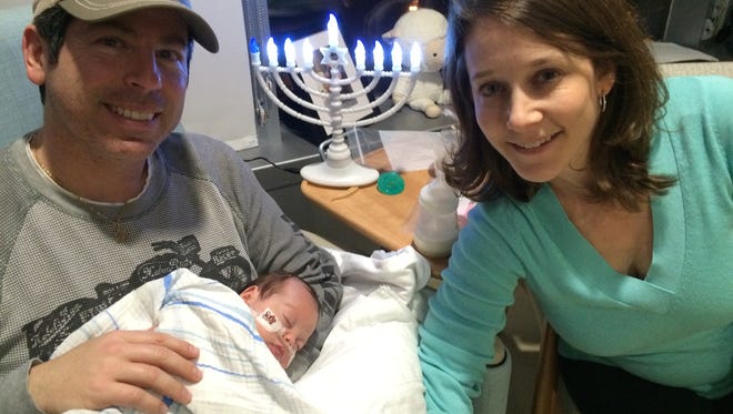 Ben Tulgan, seen here with his parents, Sasha and Adam Tulgan, is now an exuberant 19-month-old boy. Ben spent 147 days in the NICU at Golisano Children’s Hospital following his premature birth. The family looks forward to celebrating Passover.