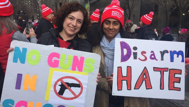 Verona residents Christine McGrath, left, and Toral Patel march with Moms Demand Action during the New York City Women’s March on Jan. 21, 2017.