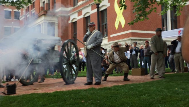 A crowd gathers for the first firing of a new Civil War era cannon at the Montgomery County Courthouse May 12.