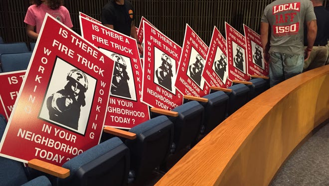 About two dozen Wilmington firefighters attended the City Council vote on the operating budget, which passed and allowed for the elimination of 16 vacant positions.