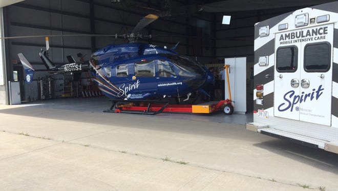 A helicopter and ambulance for Ministry Spirit Medical Transportation Services sit in a hangar at the Stevens Point Municipal Airport on July 12, 2017. The service has been relocated from Marshfield.
