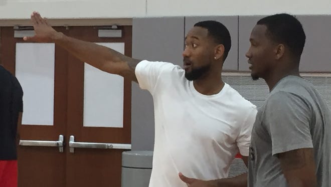 Former Ohio State men's basketball players David Lighty, left, and William Buford talk during a practice before The Basketball Tournament.