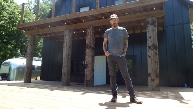 Luke Tweedy stands on the stage attached to his Lone Tree music studio Flat Black Studios on July 7, 2017.  The stage will host a series of musicians during the first Grey Area music festival, which will be held Aug. 18-19.