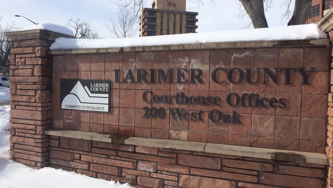 The sign outside the Larimer County Courthouse
