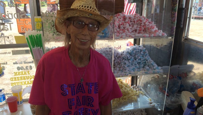 Joan Ehlers is a third-generation taffy seller and has been coming to Marshfield's Central Wisconsin State Fair since she was a child. She sells taffy out of her McMeen's State Fair Taffy stand.