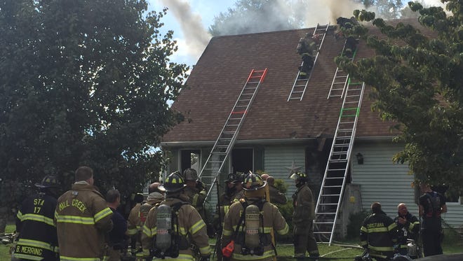 Multiple fire crews were called to the Laurel Hills development near Elsmere Friday afternoon for a house fire.