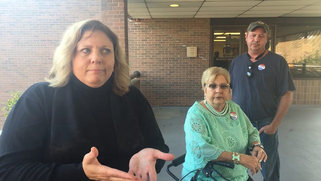 Christina Marrongelli, left, stands with Vesta Hathaway and her son Randall, right, outside the state Board of Medical lLcensure office after addressing the board about her alleged injury caused by surgery in 2015.