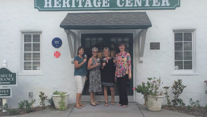 Vero Vino team members Cindy Kientz, Barbara Petrillo, Patti Carlson and Susan Rane toast at the Heritage Center.