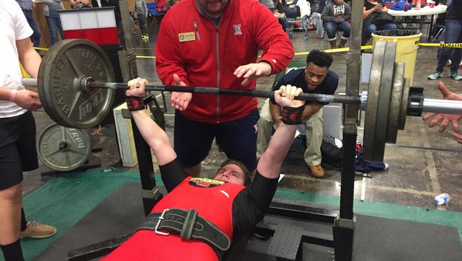 West Monroe powerlifter Cody Stinson prepares to benches 285 pounds during the Calvary Invitational Saturday afternoon.